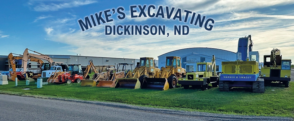 Mikes Excavating Dickinson Machines On Grass