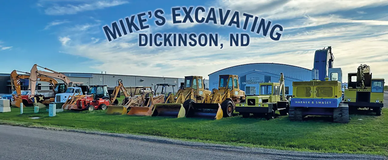 Mikes Excavating Dickinson Machines On Grass